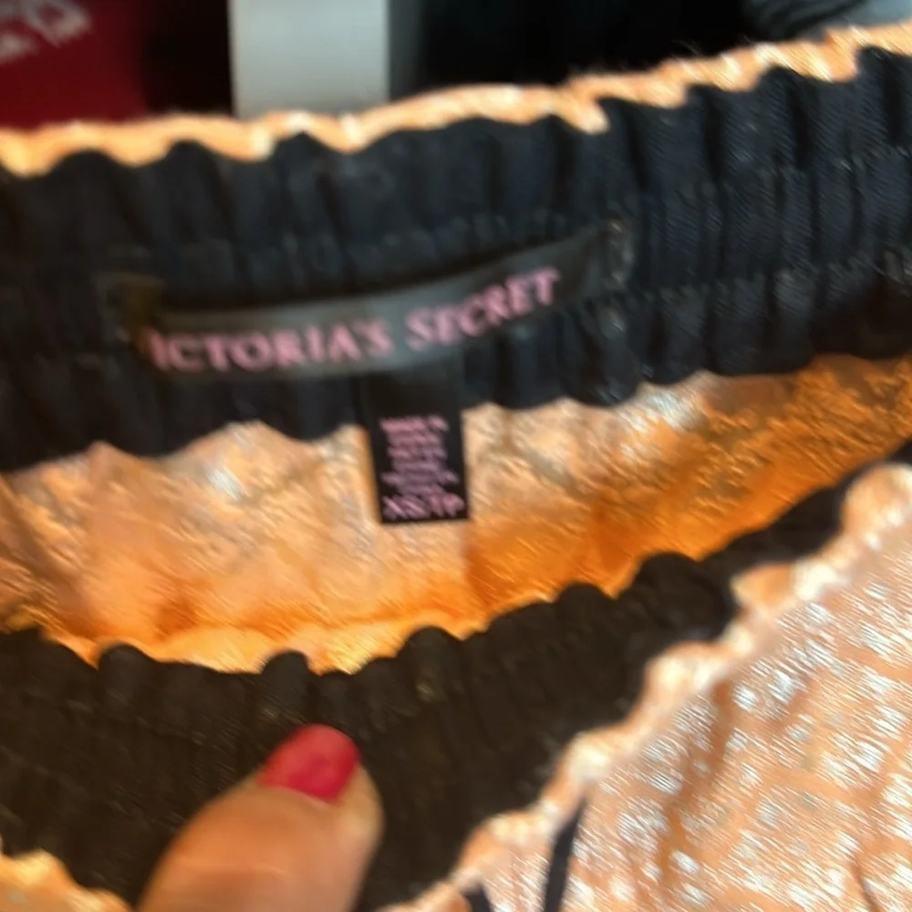 Victoria’s Secret orange and black with silver design 3 1/2” shorts size XS